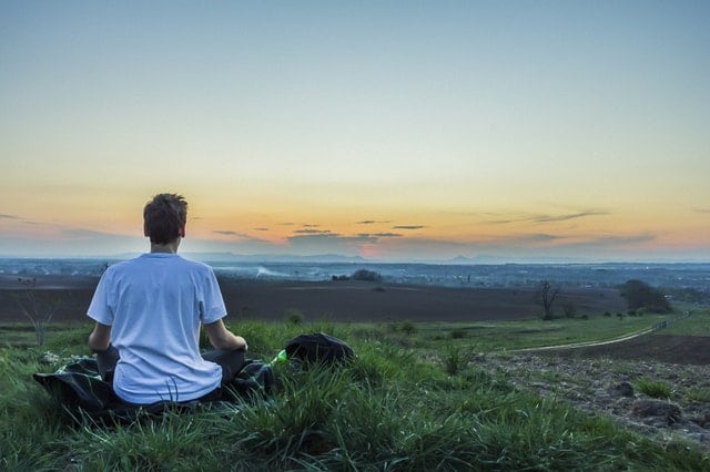 man meditating outside in Tucson