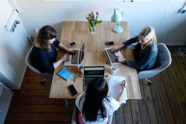 Woman sitting around a conference table in Tucson