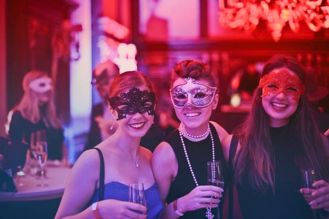 People smiling at a cocktail party in Tucson 