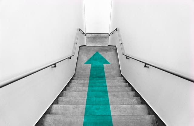 flight of stairs with a downward arrow 