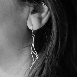 woman's ear with a large earring