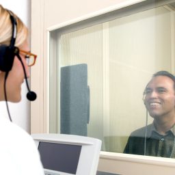Patient with headphones receiving hearing test