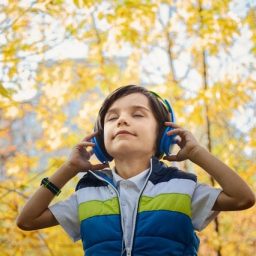photo-of-a-boy-listening-in-headphones-1490844