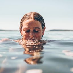 woman with her head half underwater