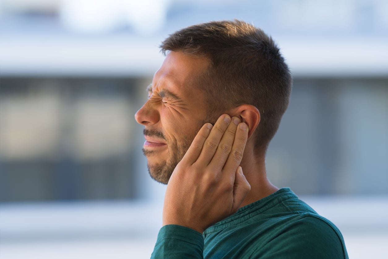 Man with tinnitus flinches