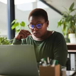 Woman looking at her computer screen