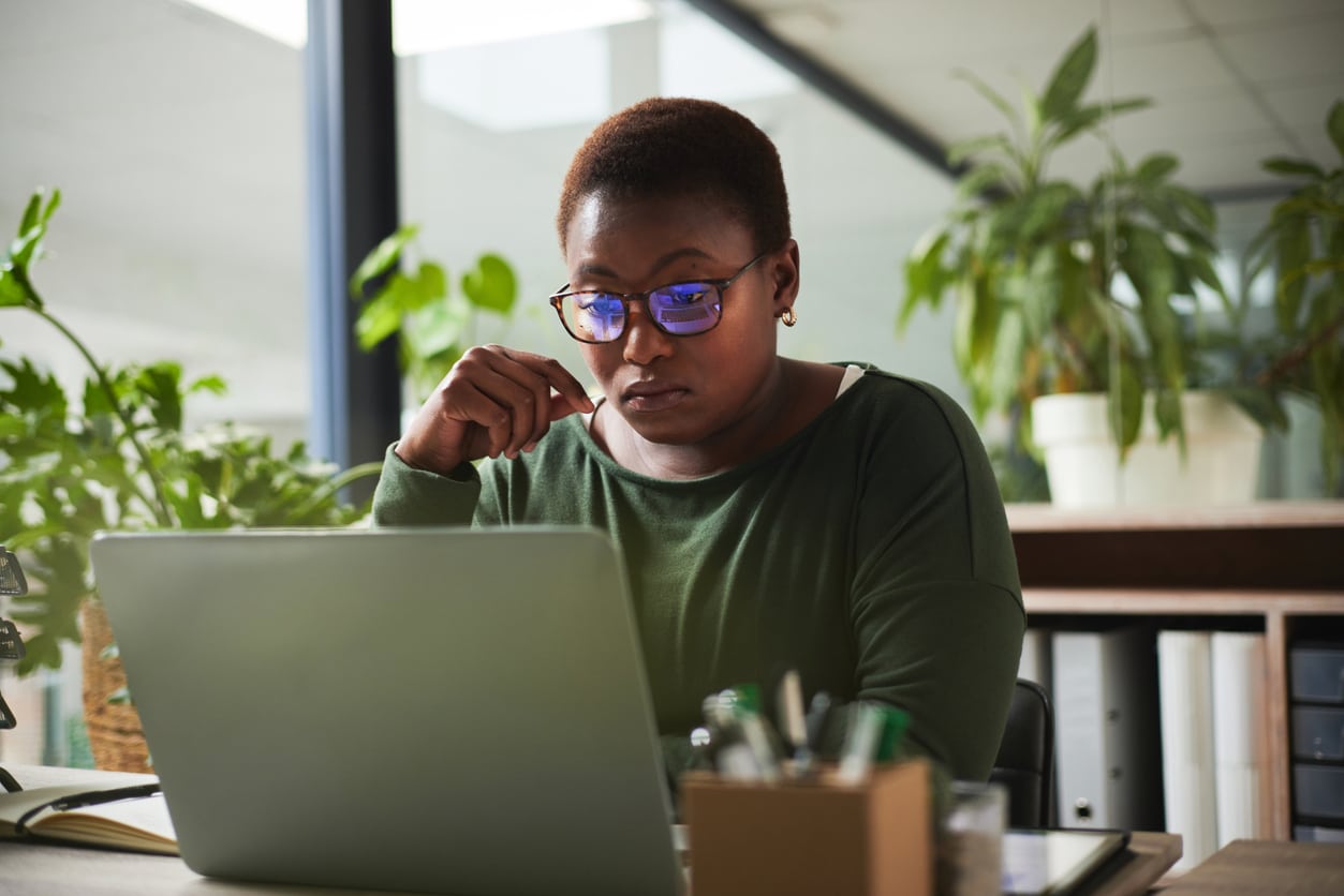 Woman looking at her computer screen.