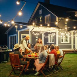 Friends and family get together for an outdoor dinner